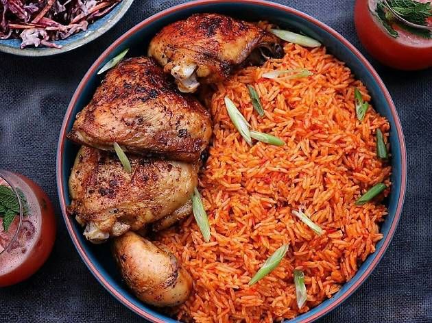 Jollof rice with grilled chicken, a signature dish at C'est La Vie Lounge